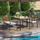 4-piece patio furniture set featuring a dining table and stackable chairs with acacia wood accents for outdoor.