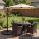 Heavy-duty 4-piece patio umbrella base in black, designed for stability with U-locking pins, perfect for 9-10 ft.
