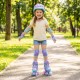 Adjustable kids roller skates in purple with light-up wheels, safety gear, and colorful graffiti for fun outdoor.