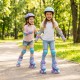 Kids wearing adjustable purple roller skates with light-up wheels, enjoying a sunny day in the park.