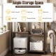 Four-tier rustic brown kitchen baker's rack with ample storage for appliances, robot vacuum, and decorative items.