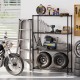 4-tier black metal storage shelving unit with V-shaped wire racks, ideal for garage organization and tool storage.