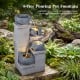 4-tier outdoor water fountain with cascading bowls and LED lights, made of durable resin for a calming atmosphere.