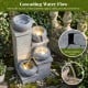 4-tier outdoor water fountain with cascading bowls and LED lights, creating a calming ambiance for relaxation.