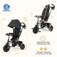 4-in-1 black baby tricycle with adjustable canopy, reversible seat, and 5-point safety harness for toddlers.