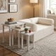 Convertible sofa bed with side tables, featuring a soft corduroy cover and space-saving design for versatile use.
