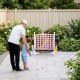 Height adjustable 4-in-1 Row Connect game in pink, perfect for family gatherings and outdoor fun with easy storage.