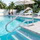 Curved 50 x 30 inch pool handrail in polished 304 stainless steel, providing stable support for easy pool access.
