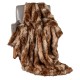 Luxurious 540GSM faux raccoon fur blanket draped over a chair, featuring a soft texture for cozy warmth and style.