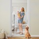 Extra tall 59" white metal pet gate with wide opening, ideal for doorways, featuring a lockable small door for pets.