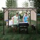 Metal frame patio gazebo with beige polyester canopy, ideal for BBQs and outdoor gatherings in your backyard.