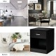 Black nightstand with storage drawer and open compartment, perfect for bedroom or living room organization and decor.