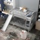 Gray twin over twin bunk bed with slide and wide-step ladder, offering a fun and safe sleeping solution for kids.