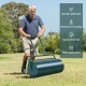 Metal push lawn roller with a green finish, 24 x 13 inches, designed for easy use and storage in lawn care.