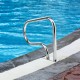Stainless steel swimming pool handrail showcasing a sleek curve design, ensuring easy grip and stable access to the.