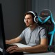 Reclining racing chair with lumbar support and footrest in blue, designed for comfort during long gaming sessions.