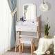 Large mirror on a vanity table set with white finish and sturdy pine wood legs, ideal for makeup application and decor.