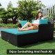 Spacious outdoor rattan daybed in turquoise with cushions and pillows, perfect for sunbathing and relaxation.