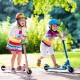 Kids riding a blue folding adjustable height kick scooter with flashing wheels, perfect for outdoor fun and safety.