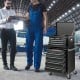 5-drawer black tool storage cabinet with central locking system, swivel wheels, and top platform for versatile workshop.