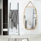 30-inch modern rectangle wall-mounted mirror with bamboo frame and adjustable leather strap, perfect for any room decor.