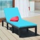 Height adjustable rattan lounge chair with blue cushion, ideal for patio or poolside relaxation.