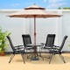 Two portable black patio folding dining chairs with adjustable headrests and a glass table under an umbrella in a.