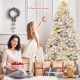 6 feet hinged unlit artificial silver tinsel Christmas tree with 1036 branch tips, perfect for indoor and outdoor.