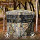 Three-person portable hunting blind with vivid camouflage, multiple windows, and easy setup for outdoor use.