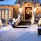 5 ft animated Christmas tree with warm and cold LED lights, elegantly lit for outdoor holiday decoration.