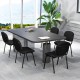 Conference room featuring a set of 5 black office chairs with metal frames and padded cushions for ergonomic support.
