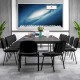 Black office chairs with padded cushions and metal frames arranged around a conference table for meetings.