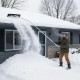 Extendable aluminum snow removal tool with wide blade, angled head, and non-slip handle for easy roof snow clearing.
