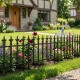 Decorative metal garden fence with fleur-de-lis finials, ideal for flower beds and easy no-dig installation.