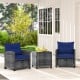Two navy cushioned chairs and a square glass-top table in a patio setting, perfect for outdoor relaxation.