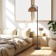 Arc floor lamp with a black pole and woven hanging lampshade, ideal for living room or bedroom lighting.