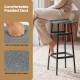 Close-up of a padded barstool seat in gray linen fabric, featuring soft sponge cushioning for comfortable dining.