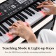 61-key electric keyboard with light-up keys and teaching mode, perfect for beginners, shown with hands on keys.