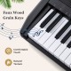 Faux wood grain keys on a black electric keyboard, featuring comfortable touch and natural texture for beginners.