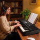 Portable 61-key electric piano keyboard in black, featuring teaching mode, 200 rhythms, and 200 tones for beginners.