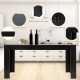 Rectangular black dining table for 6, featuring a smooth surface and sturdy wood frame, ideal for kitchens or dining.