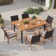 Outdoor dining table with acacia wood top and metal legs, seating six, featuring an umbrella hole for versatile use.