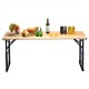 Outdoor wood folding picnic table showcasing food and drinks, featuring adjustable heights and a rustic design for.