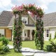 Garden arch trellis made of black PE-coated metal, designed for climbing plants and as a wedding backdrop.
