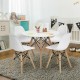 Mini-sized white DSW dining chair set with wood legs, ideal for kids' playroom or nursery activities.