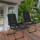 Two black outdoor folding patio chairs with adjustable backrests, perfect for relaxing in the garden or backyard.
