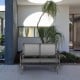 Gray 48-inch swing glider loveseat with curved backrest and armrests, perfect for outdoor patios and gardens.