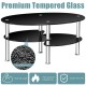 Oval black coffee table made of tempered glass with a smooth design, featuring two shelves for stylish and practical.