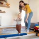 Child practicing on the blue 7 feet folding balance beam with handles, designed for safety and confidence building.