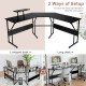 L-shaped black computer desk with monitor stand, versatile setup for corner or long desk use, ideal for home office.